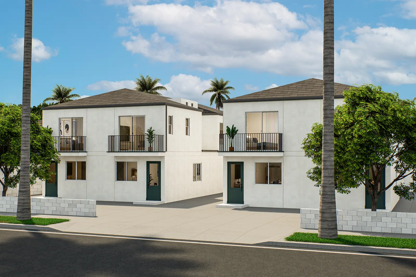 Modern duplex buildings with balconies and palm trees under a blue sky.