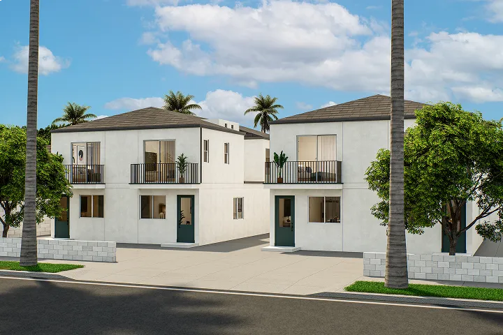 Modern duplex buildings with balconies and palm trees under a blue sky.