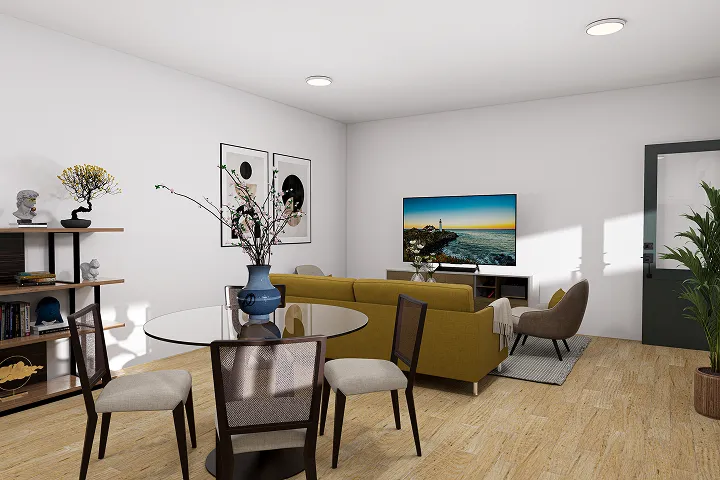 Stylish open living and dining area with mustard sofa and glass table.